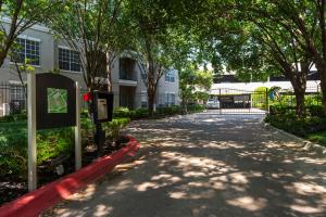Apartments in Houston, Texas - Exterior Building with Gate and Site Map Sign