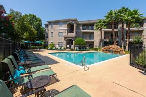 Apartments For Rent in Houston, TX - Pool and Patio with Lounge Chairs